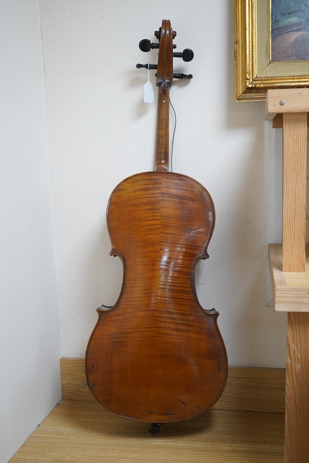 A late 19th century small cello, unsigned and without label inside body, stamped inventory number 769, length of back 62cm. Condition - poor to fair